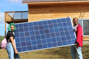 Boundless students with solar panel