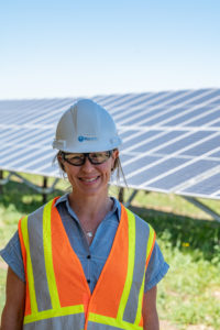 Kelly Matheson King, COO of BluEarth, at burdett solar facility