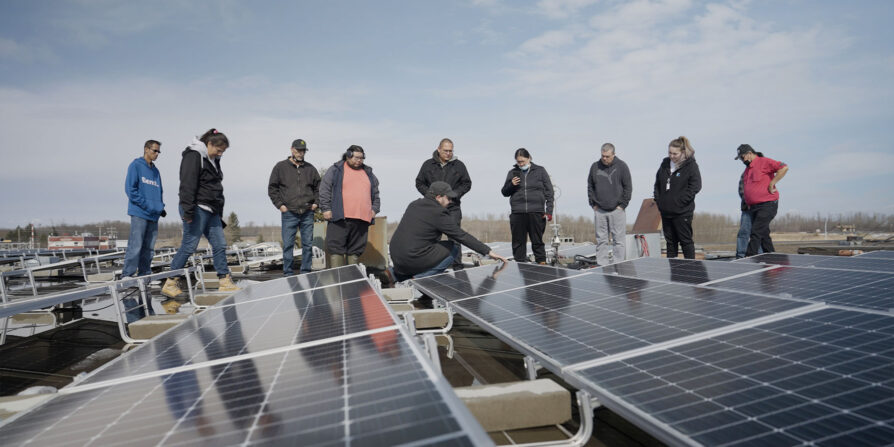 Maskwacis solar array installation with group of trainees