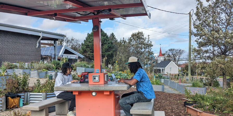 Photo of youth working at the solar awning provided to Hope Blooms by Bullfrog Power's community-based green energy projects grant